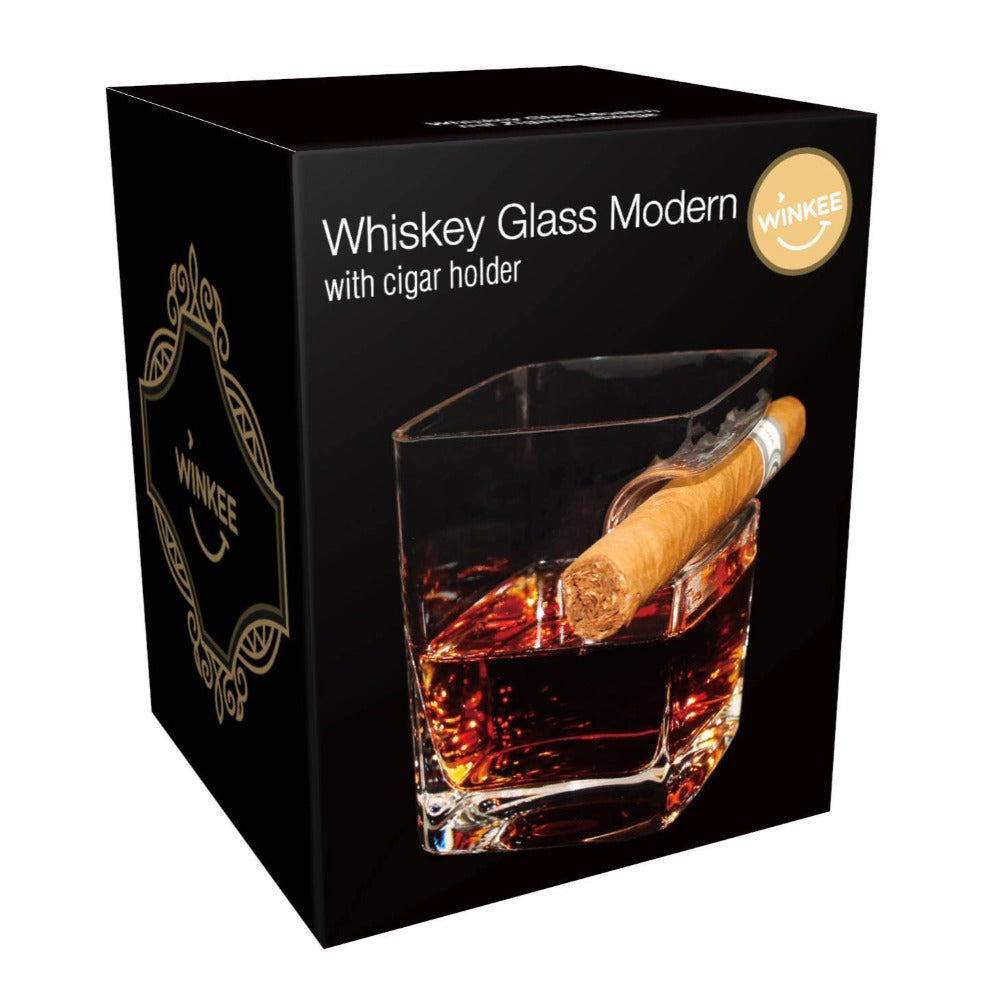 Moderni viski lasi sikarin pidikkeellä